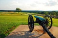 A cannon aims down the road in the Gettysburg National Battlefield Royalty Free Stock Photo