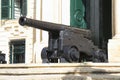 Cannon before Auberge de Castille Royalty Free Stock Photo