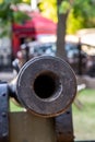 Cannon barrel with round hole close-up, traditional fort guard weapon