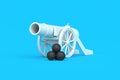 Cannon with cannonballs on blue background. Old weapon