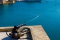 A cannon firing at a boat. Humour concept. Valletta Malta