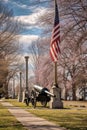 cannon in a historic military park with american flag at half-mast