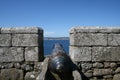 Cannon looking out to sea from castle Royalty Free Stock Photo