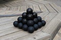 Cannonballs sitting on top a Cannonball gun turret ready for loading.