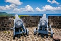 Cannons at Brimstone Hill Fortress National Park on St. Kitts face the Caribbean Sea Royalty Free Stock Photo