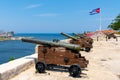 Cannons at Fort of Saint Charles, cuban flag in Havana Royalty Free Stock Photo