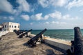 Cannons line the cape coast castle Royalty Free Stock Photo