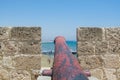 Cannons on the wall of  Medieval Castle of Larnaca Fort and blue sea in Cyprus Royalty Free Stock Photo
