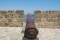 Cannons on the wall of  Medieval Castle of Larnaca Fort and blue sea in Cyprus Royalty Free Stock Photo