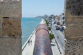 Cannons on the wall of  Medieval Castle of Larnaca Fort and blue sea in Cyprus Royalty Free Stock Photo