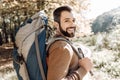 Cheerful handsome man caring a rucksack Royalty Free Stock Photo
