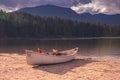 Canoe along shore of Hidden Lake in Whistler, British Columbia