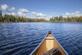 Canoe on a blue lake in northern Minnesota during autumn Royalty Free Stock Photo
