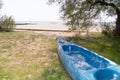 Canoe boat kayaks with paddles near the sea lying on the sand of the beach Royalty Free Stock Photo