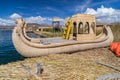 Canoe boat at Uros floating island and village on Lake Titicaca near Puno, Peru Royalty Free Stock Photo