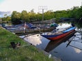 Canoe boats lined up on the edge of the estuary.