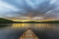 Canoe bow on a Canadian lake at sunset Royalty Free Stock Photo