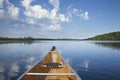 Canoe on calm northern Minnesota lake in the morning Royalty Free Stock Photo