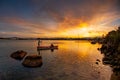 Canoe crossing at sunset in Guarda do Embau Beach - Santa Catarina Brazil