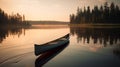 Canoe drifting on the lake at sunset