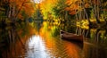 Canoe gliding through river lined withorange and yellow birch trees in fall Royalty Free Stock Photo