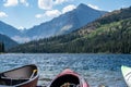 Canoe and kayak on the beach at Two Medicine lake in Glacier National Park. Royalty Free Stock Photo