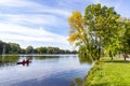 Canoe in the lake which colorful trees