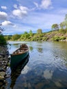 Canoe moored on riverbank Royalty Free Stock Photo