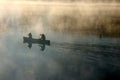 Canoe in the morning mist Royalty Free Stock Photo