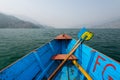 Canoe and paddles on Fewa lake