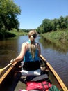 Canoe paddling on small stream Royalty Free Stock Photo