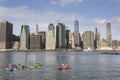 canoe polo in east river new york city with lower manhattan skyline in the background Royalty Free Stock Photo