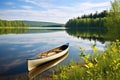 canoe resting beside a serene lake