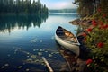 canoe resting on shore with scenic lake view
