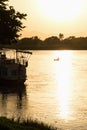 Canoe in the river during sunset Royalty Free Stock Photo