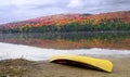 Canoe on shore with Autumn Colours