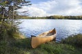 Canoe on the shore of a northern Minnesota lake during autumn Royalty Free Stock Photo