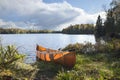 Canoe on the shore of a northern Minnesota lake during autumn Royalty Free Stock Photo