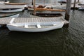 Canoe, small sailboats and fishing boats moored to floating docks, maritime, background with copy space