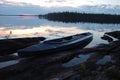 Canoe at stone bank of Engozero lake,Polar Karelia, Russia Royalty Free Stock Photo