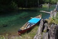 Canoe Tethered To A Lake Shore
