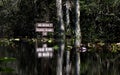 Canoe trail directional sign for Big Water shelter and Floyd`s Island in the Okefenokee Swamp National Wildlife Refuge, Georgia Royalty Free Stock Photo