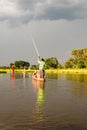 Canoe trip with traditional mokoro boat on river through Okavango Delta near Maun, Botswana Africa Royalty Free Stock Photo