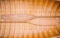 Canoe with two wooden paddles forming a symmetrical pattern. Royalty Free Stock Photo