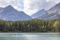 Canoe on the Wedge Pond surrounded by rocky hills in Banff National Park, Alberta, Can Royalty Free Stock Photo