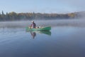 Canoeing on an Autumn Lake Royalty Free Stock Photo
