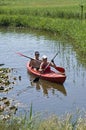 Canoeing in the countryside on a narrow waterway