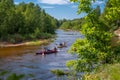 Canoeing on the forest river. Friends driving with kayak on forest river. summer day. canoe trip on the river in the summer Royalty Free Stock Photo