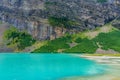 Canoeing on Lake Louise in sunmmer day. Banff National Park, Alberta, Canada. Royalty Free Stock Photo