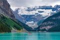 Canoeing on Lake Louise in sunmmer day. Banff National Park, Alberta, Canada. Royalty Free Stock Photo